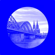 Image of Cologne's Hohenzoeller-bridge with Cologne's cathedral in the background embedded in branding elements for eyeo.com