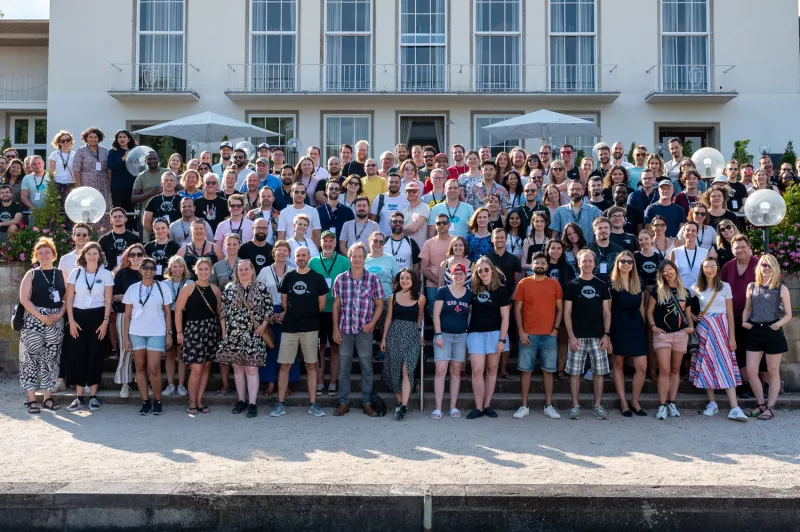 A group photograph of all employees of the company, gathered together for a collective picture, showcasing the diverse and inclusive workforce